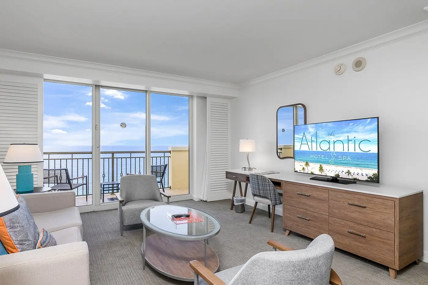 Suite living area with ocean view balcony
