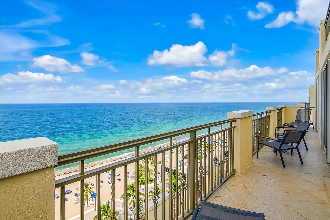 Beachfront terrace with ocean and pool views