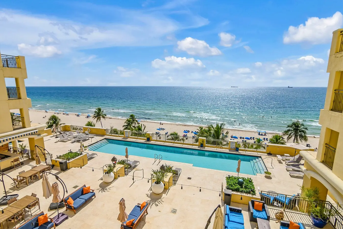 Pool deck overlooking beach and ocean